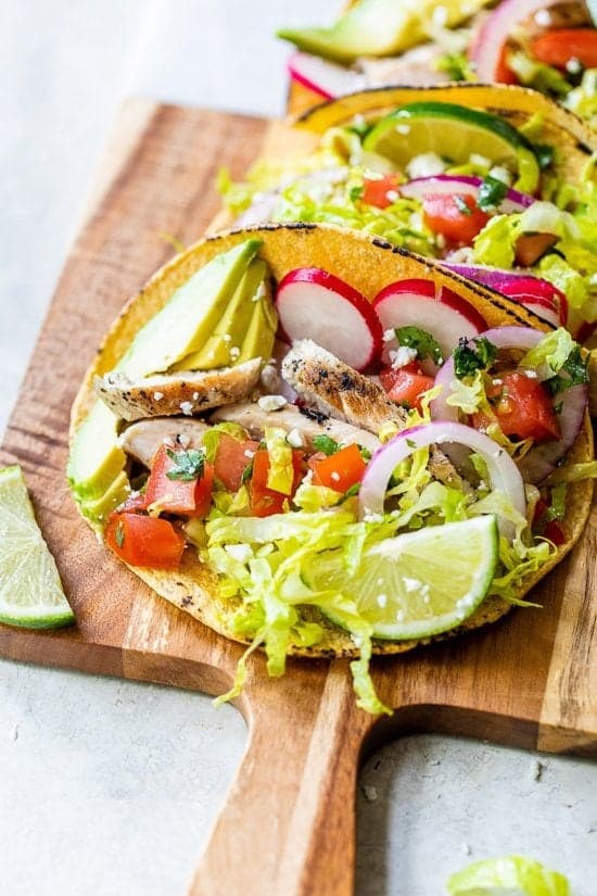 Grilled Chicken Tacos with Lettuce Slaw, Avocado and Cotija